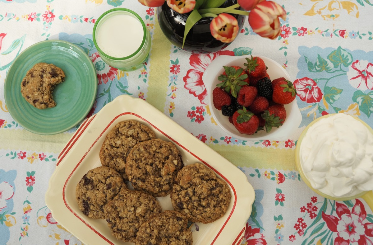 Freshly baked cookies with berries and cream